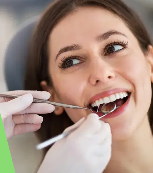 Dentist examining a smiling patient